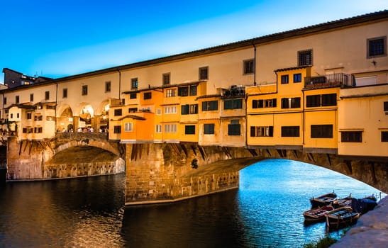 Florence, Italy - Circa June 2021: sunset on Ponte Vecchio - Old Bridge. Amazing blue light before the evening.