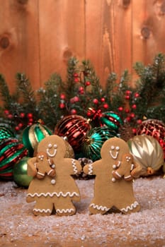 Gingerbread Family of 2 kids on Holiday Christmas Background