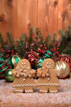 Gingerbread Family of 3 kids on Holiday Christmas Background