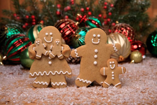 Gingerbread Family of 3 kids on Holiday Christmas Background