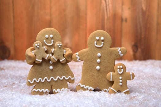 Gingerbread Family of 3 kids on Holiday Christmas Background