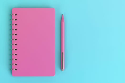 Pink spiral notebook and plastic pen, top view