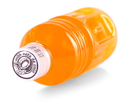 The Orange juice glass bottle with white lid. Isolated on white background