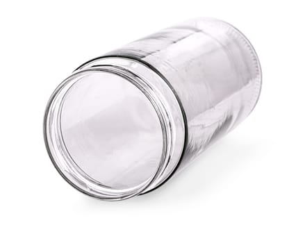 The glass empty jar on the side isolated on white background