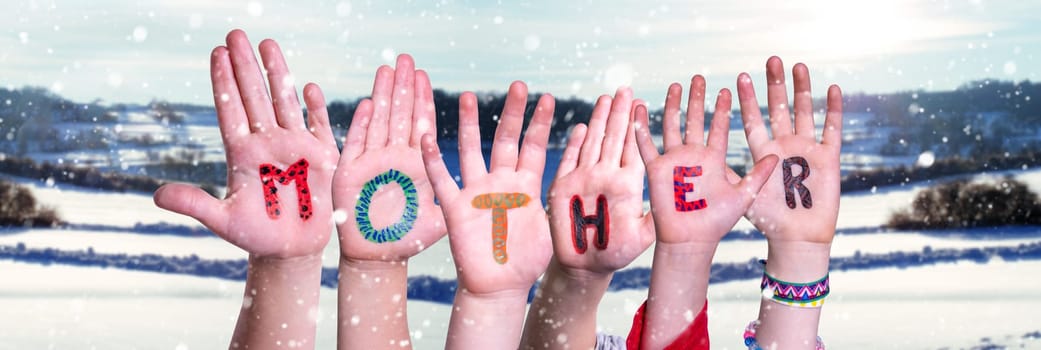 Children Hands Building Colorful English Word Mother. Snowy Winter Background With Snowflakes