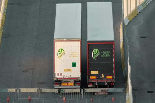 Civitavecchia, Italy - February 6, 2025: A logistics area with cargo containers, reflecting a modern freight transport infrastructure. Concept: Supply chain management