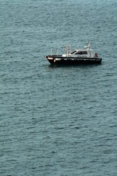 Civitavecchia. Italy - February 07, 2025: Coastal guidance vessel that ensures safe berthing in ports. Essential for the international movement of goods. Concept: Shipping industry and safety