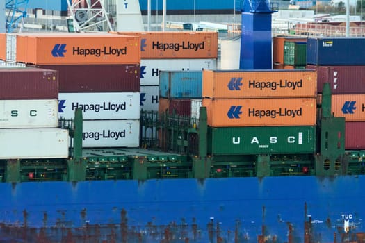 Civitavecchia, Italy - February 7, 2025: Aerial view of a cargo ship loaded with colorful containers, symbolizing the global supply chain. Concept: International trade, global supply chain