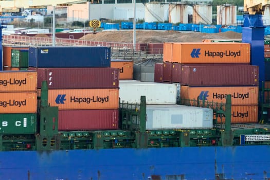 Civitavecchia, Italy - February 7, 2025: Cargo containers on a ship. Shows import and export operations and commercial transport. Essential infrastructure for the global economy.