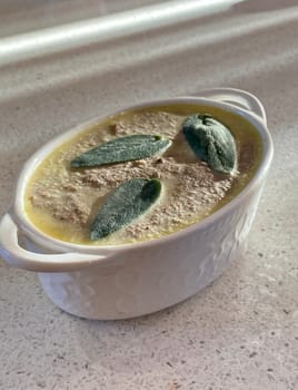 French liver pate in a white plate. Festive serving of liver pate. High quality photo
