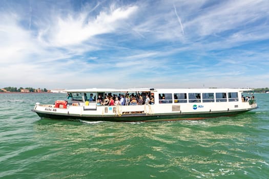 Venice, Italy - July 5, 2021:  the ferry on the way to Venice with view to St. Mark's square.