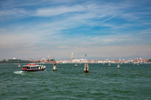 Venice, Italy - July 5, 2021:  the ferry on the way to Venice with view to St. Mark's square.