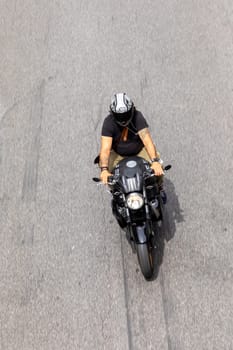 Rome, Italy - August 4, 2021: people on Motorbike in Rome in areal view. Many people in Rome use Motorbikes to avoid traffic jam.