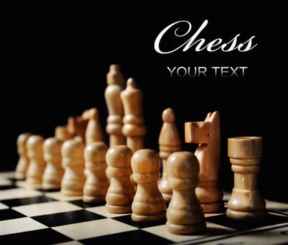 White chess pieces on black background