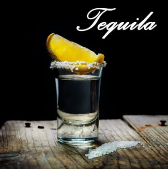Tequila shot with lemon slice and salt