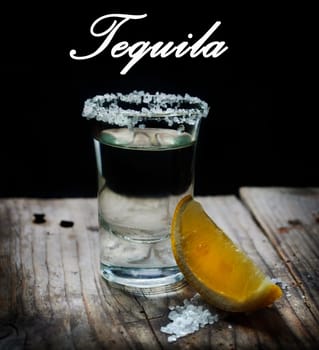 Tequila shot with lemon slice and salt