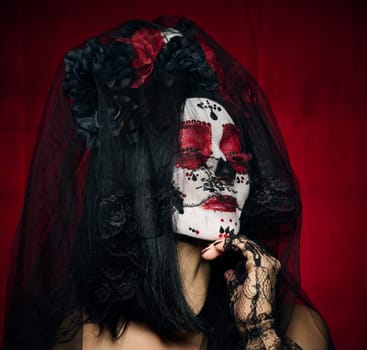 beautiful woman with a sugar skull makeup with a wreath of flowers on her head, red background