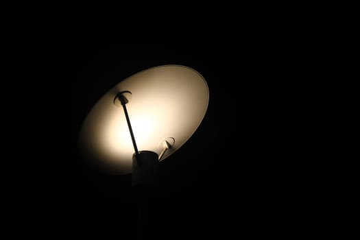 The shadows of the lights of a design lamp during the night on the street