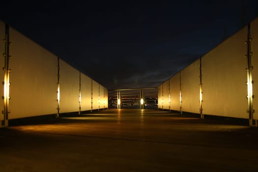 The pier walk with the baluster and the lights in the night in New York City