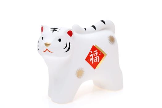 Dolls of Tora Tiger. Japanese new year card. Japanese new year tiger object. Japanese word of this photography means "fortune"""
