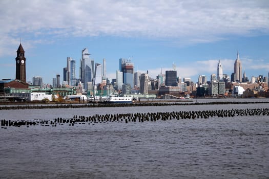 Midtown Manhattan and Hoboken train station with the Hudson river in the middle from Jersey City