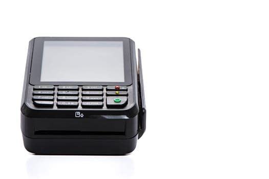 black payment terminal close-up for accepting money from plastic cards from customers on a white isolated background, copy space. High quality photo
