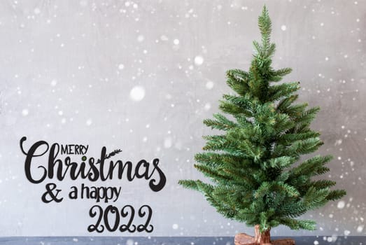 Egnlish Calligraphy Merry Christmas And A Happy 2022. Green Christmas Tree With Gray Concrete Background