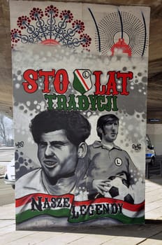 mural of the players of the Legia football club on the pillar of the bridge