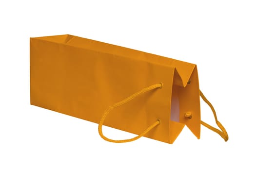 Closeup of a single yellow paper bag or pouch with yellow handle for shopping or for gifts isolated on a white background. Macro photograph.