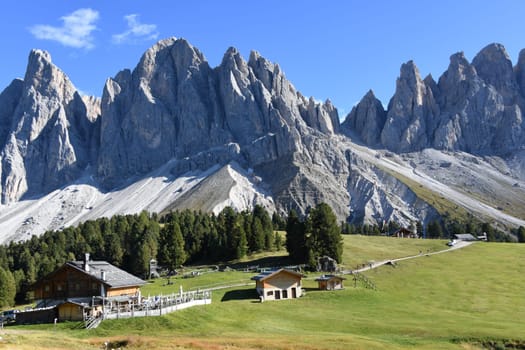 Panoramic view over the Geisleralm,Gschnagenhardt Alm in front of the mountain massif of the Geislerspitzen - Geislergruppe in the Dolomites,Villnösstal,South Tyrol. The alpine pastures can be reached via the Adolf-Munkel-Weg. Gschnagenhardtalm