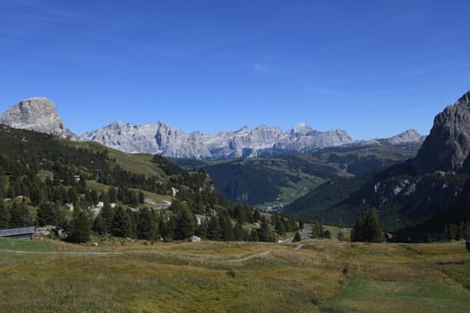 Panoramic view from the Gardena Pass to the Alta Badia Corvara valley and the Marmolada in Italian Marmolada and Ladin Marmoleda. It is the highest mountain in the Dolomites. Colfosgh with Mountain Sassongher