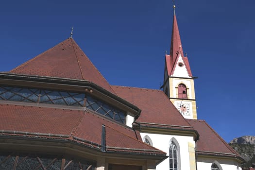 The parish church of St. Anthony Abbot and St. Christina is a church in S. Cristina in Val Gardena in Val Gardena in South Tyrol,Italy. The choir was built in the Gothic style.