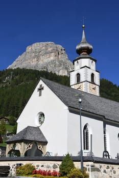 Colfosco,Ladin Calfosch,Italian Colfosco is a village in South Tyrol,Ladinia in Italy. It is located in the Dolomites in the Alta Badia holiday region. Church of St. Vigil and Mount Sassongher.