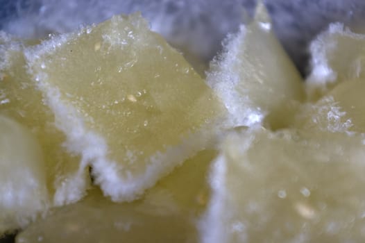 Lemon juice ice cubes with lemons . Frozen lemon juice preservation. Different ways to use lemon.