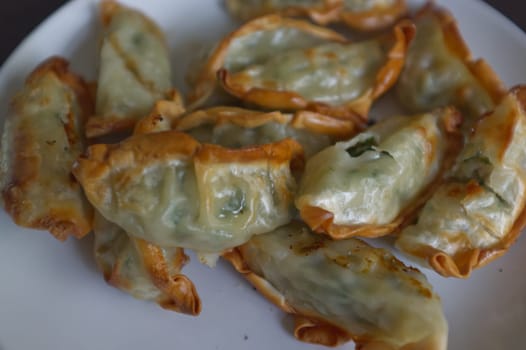 Fried dumplings or  " Gyoza """