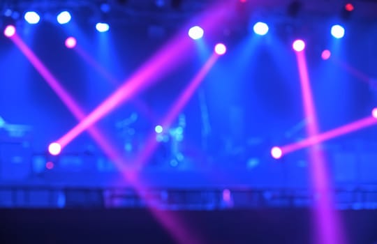 Stage light with colored spotlights and smoke. Spotlights of concert scene
