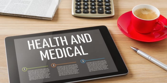 A tablet on a desk with the headline Health and medical