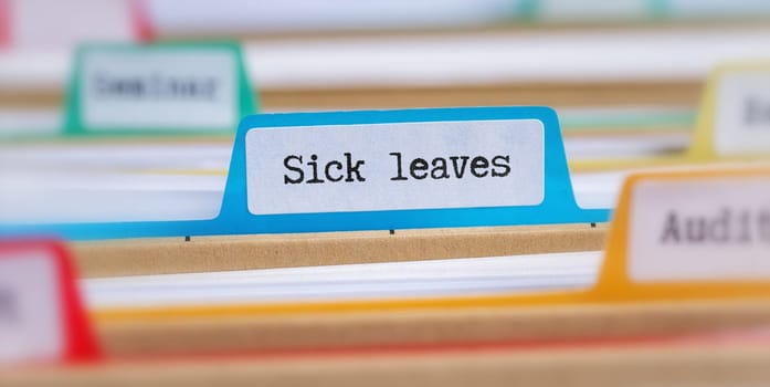 File folders with a tab labeled Sick Leaves