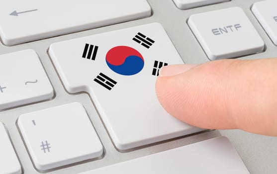 A keyboard with a labeled button - Flag of South Korea