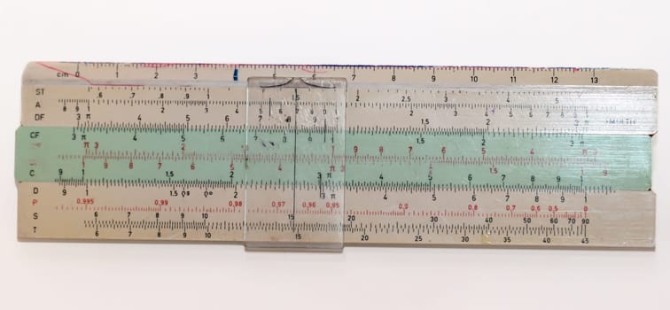 Picture of an old slide rule from GDR times that the students used. Antique calculator.