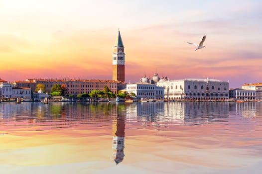 View of the Venice lagoon, St Mark's Bell Tower and Doge's palace at sunset, Italy.