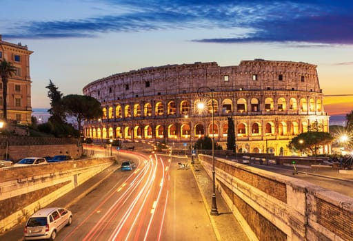 Beautiful view on Colosseum and a road nearby at sunset, Rome, Italy.