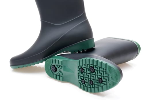Pair of black waterproof rubber boots isolated on a white background
