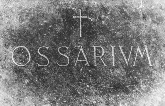 Stone with the engraving in Latin "Ossarium"" (translation from latin Ossuary)."