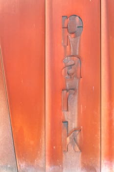 Rusty entrance to a car park. Decorative rust. Modern design. Aged, urban look. City grunge style. Urban architecture.