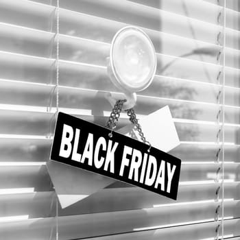 Black Friday sign board hanging outside store. Black Friday sale concept for shops.