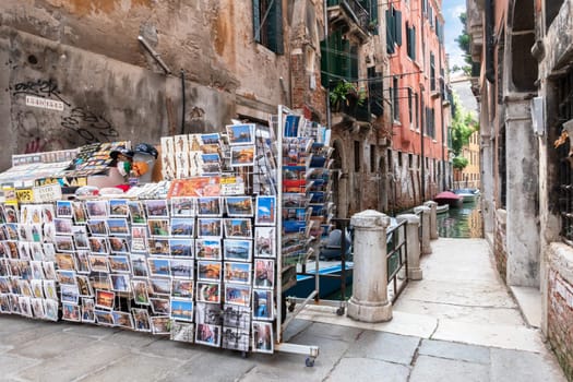 Typical "calle veneziana"" (venetian street) with postcards shop. Venice, ITALY - July 22, 2020."