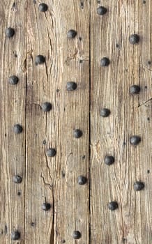 Wooden planks background. Old wooden planks with rusty bronze nails.