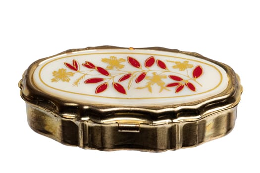 Closeup of a closed old gold casket for jewellery bracelets and luxury accessories isolated on a white background. Macro.