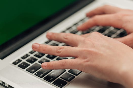Close-Up Shot of Human Hands Placed Over Laptop.
